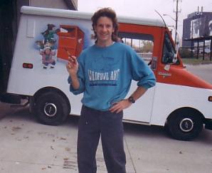 Dennis paints a Canada Post Santa parade truck